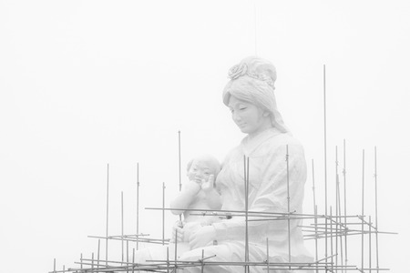 Child woman sculpture under construction, Chinese traditional style of women's imageの写真素材