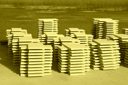 stacking slate floor tile in a construction site