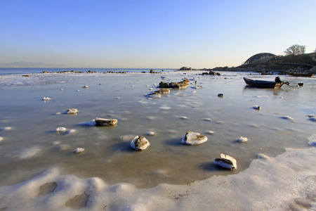ice and snow natural landscape by the sea, closeup of photoの写真素材