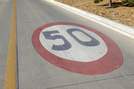 50 kilometers per hour sign on the road in a cityの写真素材