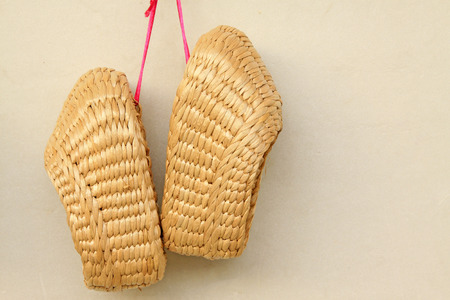 hung sandals on the wall, closeup of photoの写真素材