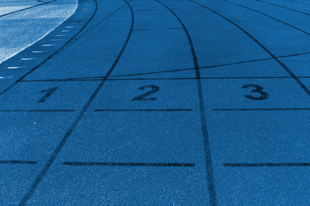 red plastic runway and numbers in a sports ground, in Beijing, Chinaの写真素材
