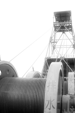 MaCheng July 12: Industrial stage winch for shaft sinking and drilling derrick in MaCheng iron mine on July 12, 2012, Luannan County, Hebei Province, Chinaのeditorial素材