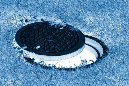 Municipal sewage manhole cover in a park north chinaのeditorial素材