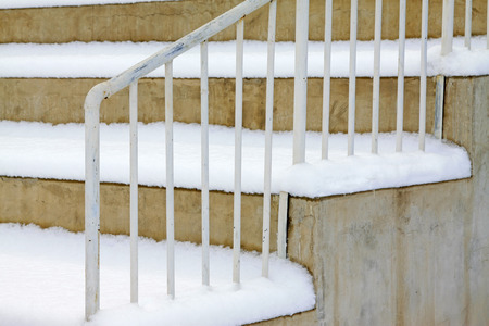 Metallic baluster in the snow, closeup of photoの写真素材