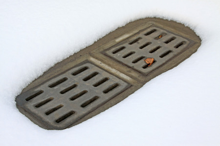 Sewer mouth and snow, closeup of photoの写真素材