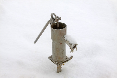 rural artificial Wells in the frost and snow, closeup of photoの写真素材