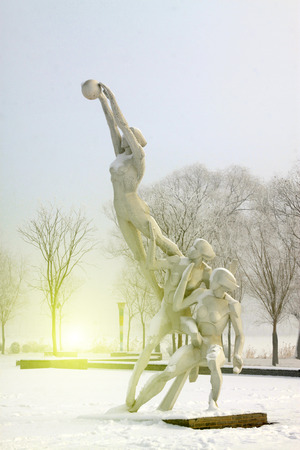 Volleyball players sculpture in the frost and snow, closeup of photoのeditorial素材