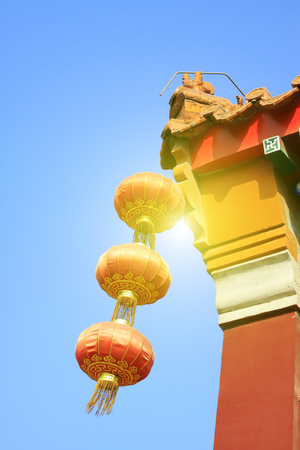 Lanterns and eaves in a templeの写真素材