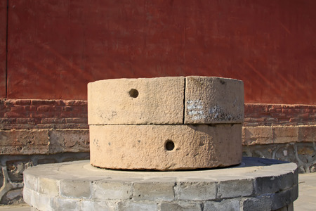 Stone mills in a temple, closeup of photoの写真素材