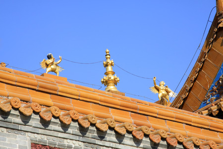 Glazed tile roof in a temple, closeup of photoの写真素材