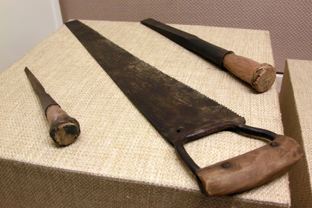 Woodworking tools - hand saw and chisel, closeup of photoの写真素材