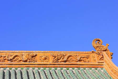 Glazed tile roof in a temple, closeup of photo
