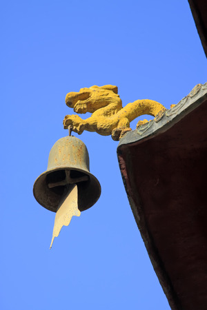 Dragon modelling wind chimes in a temple, closeup of photoの写真素材