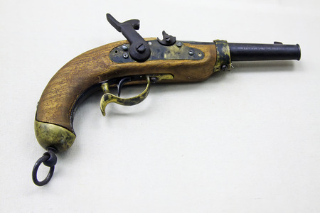 old wooden pistol, closeup of photo