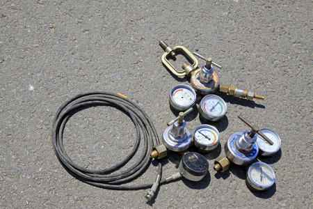 old pressure gauge on the ground, closeup of photo