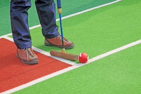 Chinese gate ball and athlete's legs, closeup of photo