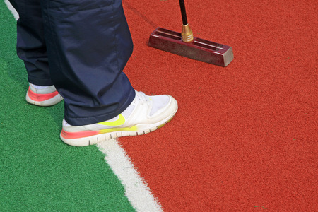 Chinese gate ball and athlete's legs, closeup of photo