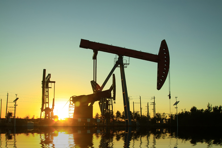 Crank balanced beam pumping unit in the oil field, closeup of photoの写真素材