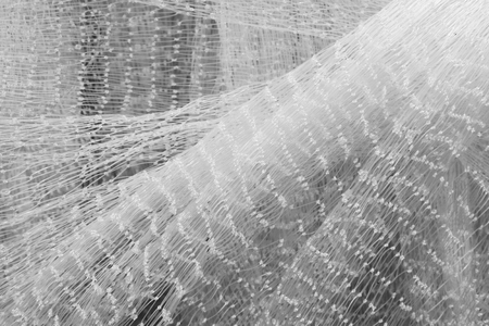 White nylon fishing nets, closeup of photoの写真素材