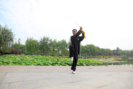 LUANNAN COUNTY - July 16: people practicing taichi on July 16, 2016, Luannan county, Hebei Province, Chinaのeditorial素材