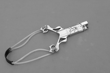 slingshot made by iron wire in orange background