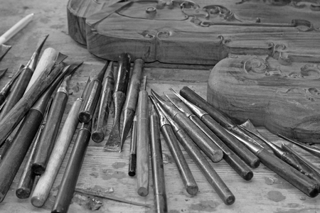 Annatto furniture carving tools, closeup of photo