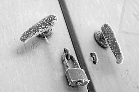 Handles and locks in the frost snow, closeup of photoのeditorial素材
