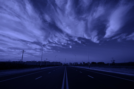 new roads under blue sky and white cloudsの写真素材