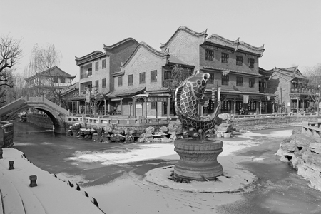 antique buildings and carp sculpture, closeup of photoのeditorial素材
