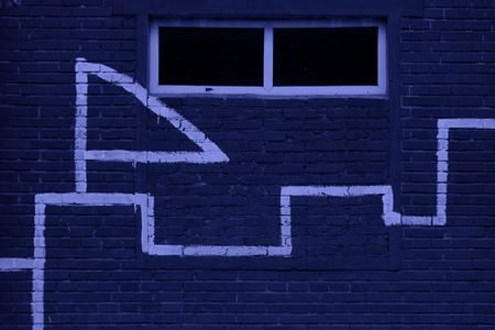 Graphic symbol in dark red house on the wall