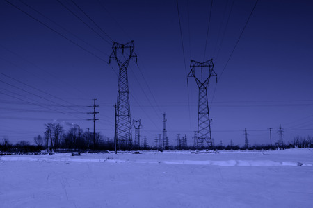 Electric power tower in the snow, closeup of photoの写真素材