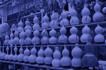 Rows of gourd on the shelf, closeup of photoの写真素材