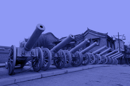 LUAN COUNTY - NOVEMBER 23: Copper artillery and antique buildings in Luanzhou city, on november 23, 2014, Luan County, Hebei Province, Chinaのeditorial素材