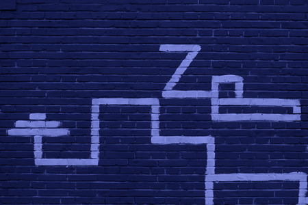 Graphic symbol in dark red house on the wallの写真素材