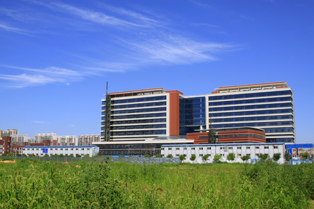 Building under the blue sky white cloudsのeditorial素材