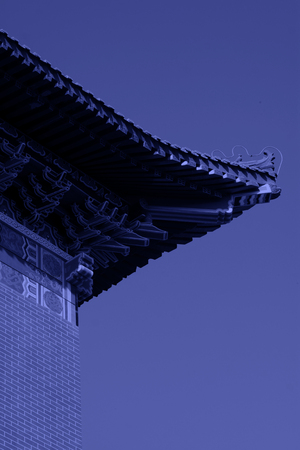 Chinese traditional building under the blue sky, closeup of photo