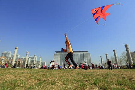 Luannan County - April 15, 2017: people fly kites in the open air, Luannan County, Hebei Province, China, April 15, 2017のeditorial素材