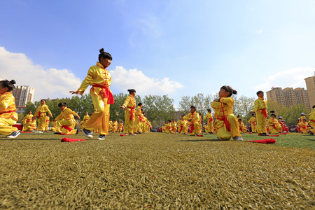 Luannan County - April 18, 2016: student group gymnastics training on the playground, in a middle school, Luannan County, Hebei Province, Chinaのeditorial素材