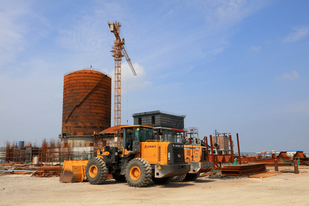 Luannan County - August 19, 2017: industrial buildings and vehicles in the outdoors, Luannan, Hebei,...