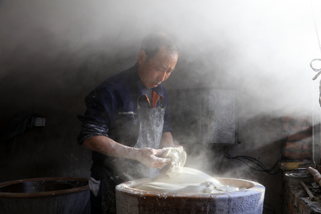 Luannan County - January 31, 2018: workers busy in producing vermicelli workshop, Luannan County, Hebei Province, Chinaのeditorial素材