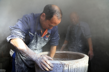 Luannan County - January 31, 2018: workers busy in producing vermicelli workshop, Luannan County, Hebei Province, Chinaのeditorial素材