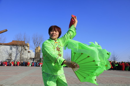Luannan County - February 10, 2017: Chinese folk dance Yangko performance on the street, Luannan County, Hebei Province, Chinaのeditorial素材