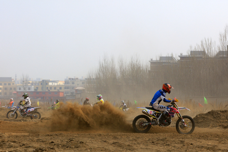 Luannan County - March 31, 2018: Cross-country motorbike field endurance race, Luannan County, Hebei Province, Chinaのeditorial素材