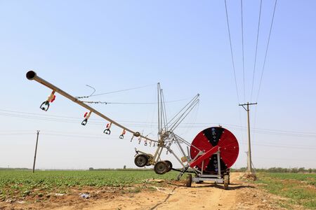 Luannan County - May 8, 2018: Self propelled high gap sprayer sprayer in field, Luannan County, Hebei, Chinaのeditorial素材
