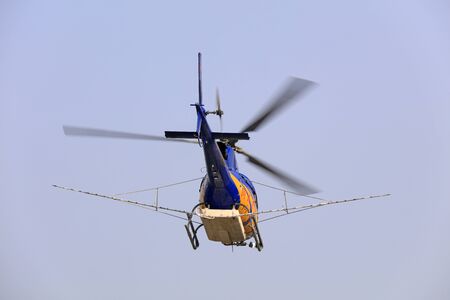 Agricultural helicopters fly in the air