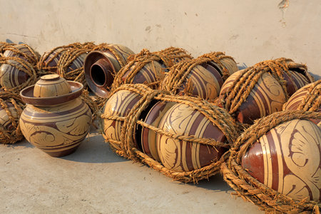 Traditional Chinese pickle jars are wrapped in straw ropesの写真素材
