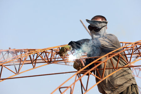 Workers weld steel skeleton of greenhouse greenhouse, Luannan County, Hebei Province, Chinaの写真素材