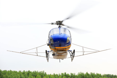 Agricultural helicopters fly in the skyのeditorial素材