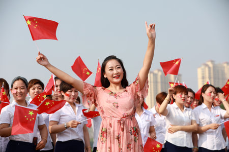 Luannan County, China-12 July, 2019: People sang patriotic songs in the square, Luannan County, Hebei Province, Chinaのeditorial素材